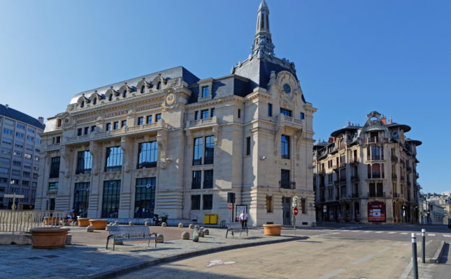 DIJON, FRANCE, May 20, 2018 : Architecture of the main post office and typical houses in city center.